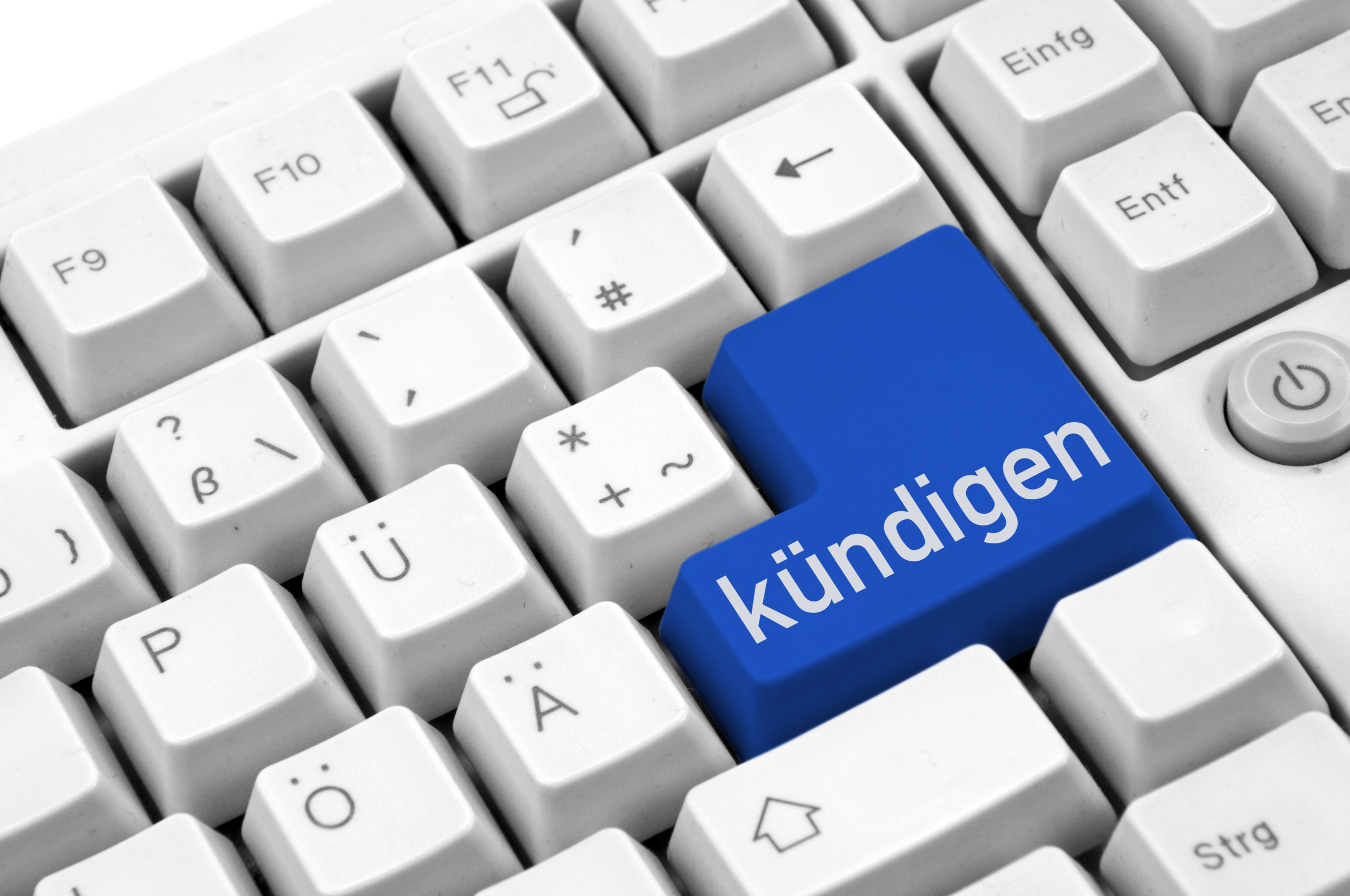 Eine blaue Taste mit der Aufschrift „Kündigen“