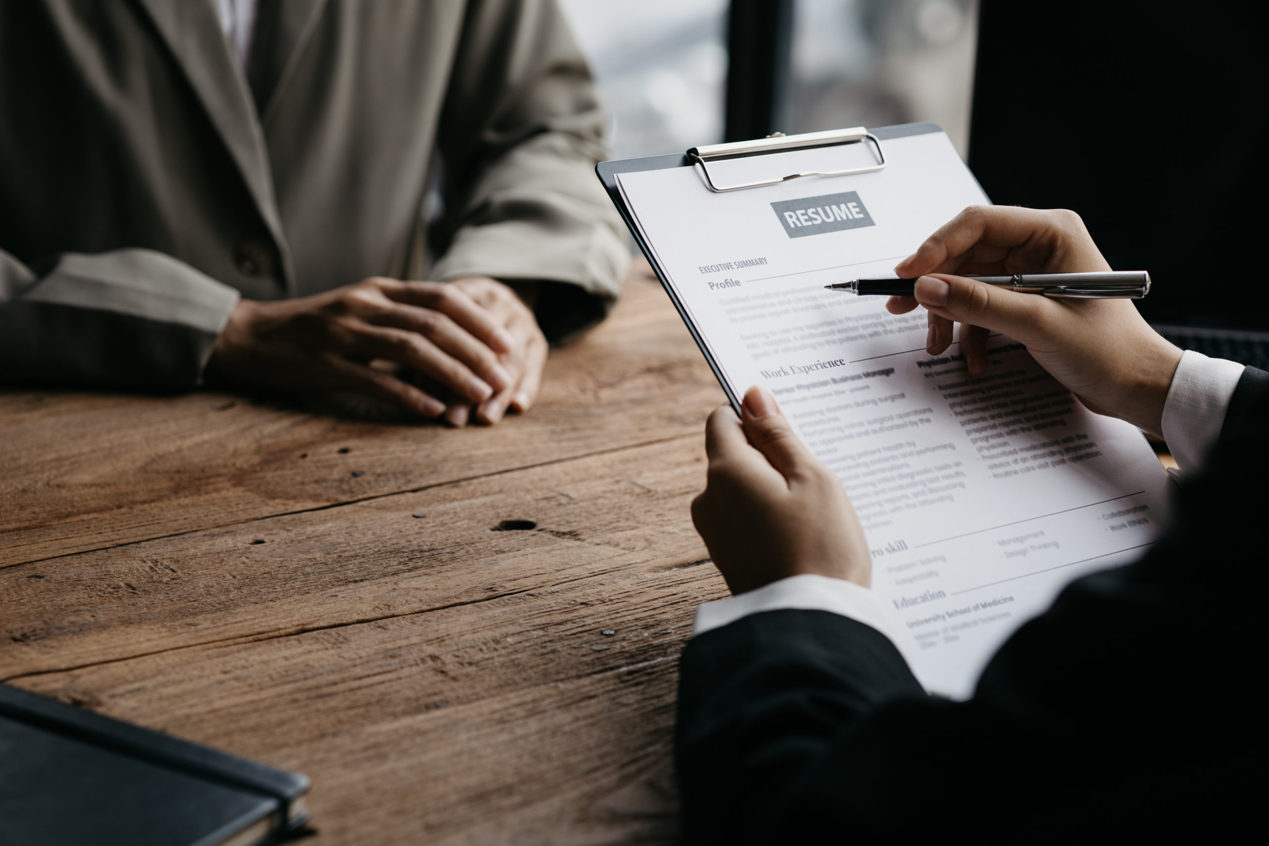 Person submitting resume to interview for a job with a company,